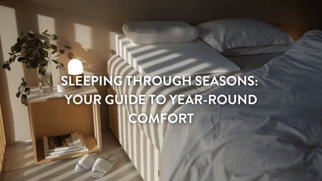 Empty double bed with sunlight casting a shadow on the white sheets