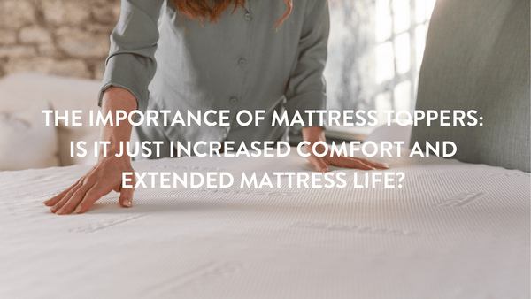 Person pressing down on a Putnams Mattress topper