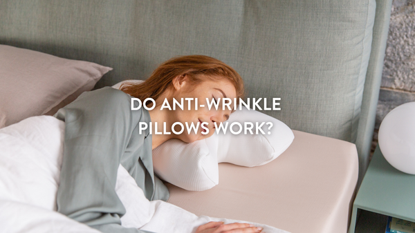 Person sleeping on a double bed using a Putnams Anti-wrinkle pillow 