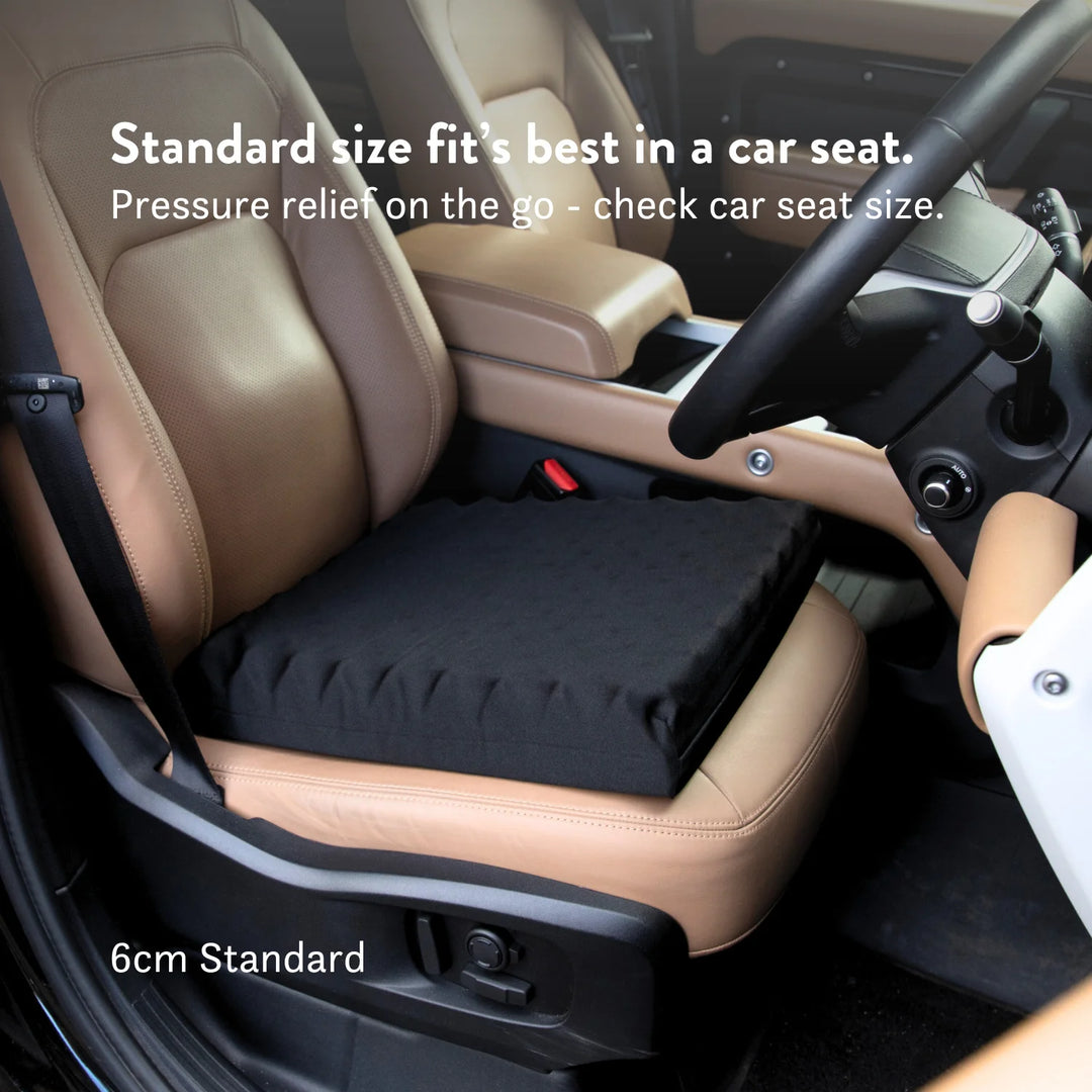 Tailbone Pain Cushion with a cut out for pressure relief at the back of the cushion. Stretch navy blue or black cover available in different sizes. High density foam with a 2 year guarantee.